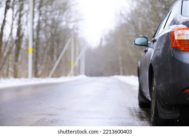 Modern Suv Car Stay On Roadside Of Winter Road. Family Trip To Ski Resort Concept. Winter Or Spring Holidays Adventure. Car On Winter Snowy Road In Mountains