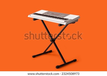 Modern synthesizer on orange background [[stock_photo]] © 