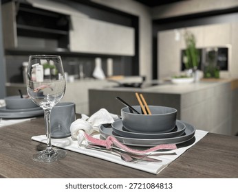 Modern Table Setting with Grey Dinnerware and Wine Glass in Contemporary Kitchen
