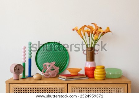 Similar – Image, Stock Photo A vase with colorful flowers stands on a landing. The wall of the house in the background is painted green.