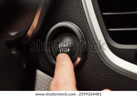 Modern technologies. The driver presses the "start-stop" button on the panel in the car