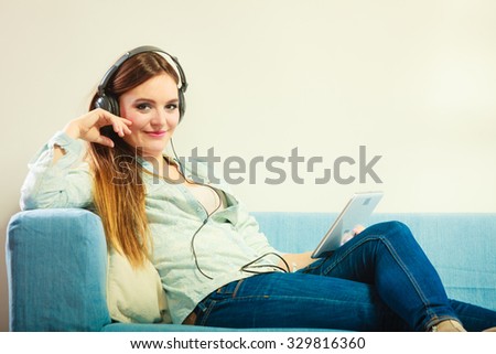 Similar – Happy woman listening to music wearing headphones