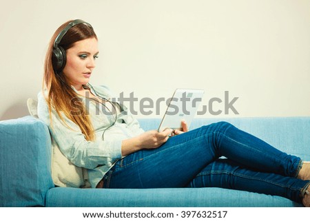 Similar – Happy woman listening to music wearing headphones