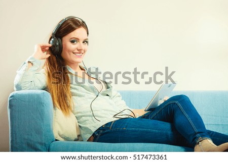 Similar – Happy woman listening to music wearing headphones