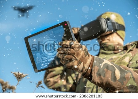 Modern technology in the army. Warfare operator using virtual reality glasses, vr controller. Pilot of aerial reconnaissance, surveillance and targeted attacks for military team and troops outdoors