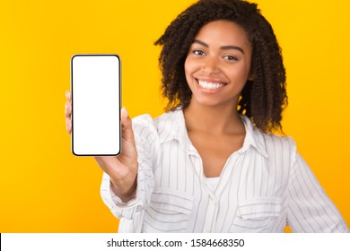 Modern Technology Concept. African American Woman Showing Blank Phone Screen, Mockup, Selective Focus