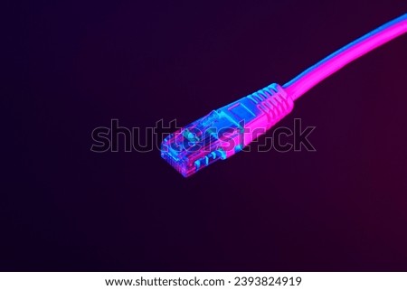 Modern technology network cable in neon light.