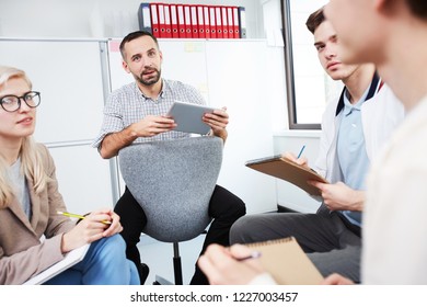 Modern Teens And Teacher Sitting In Circle At Seminar And Sharing Their Opinions