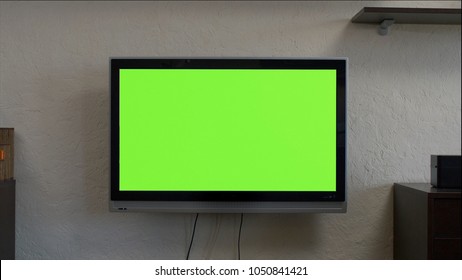 Modern Television With Chroma Key Green Screen. A Modern LCD TV With A Green Screen