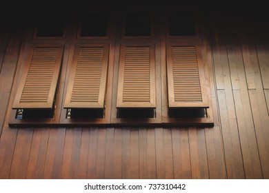 Modern Thai Style Teak Wood Awning Windows On Wooden Wall Of Traditional Thai House At Boutique Resort. Concept For Architecture, Interior And Exterior Design.