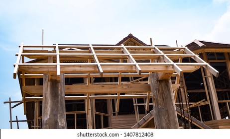Modern timber roofs.New residential construction home . the construction of a frame wooden house on a pile Foundation .  dream home. New residential construction house framing Home Under Construction