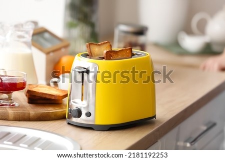 Modern toaster on kitchen table