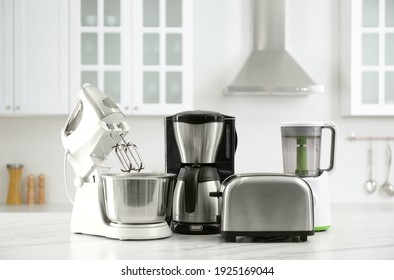 Modern Toaster And Other Home Appliances On White Marble Table In Kitchen