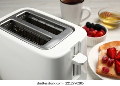 Modern Toaster And Products On Table, Closeup