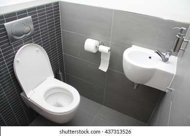 A modern toilet in different shades of grey - Shutterstock ID 437313526