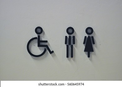 Modern Toilet Signage on White Wall