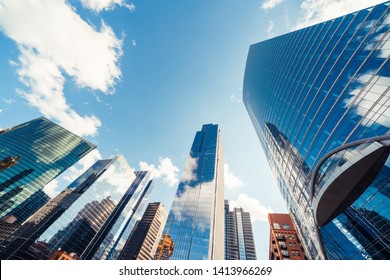 Modern tower buildings or skyscrapers in financial district with cloud on sunny day in Chicago, USA. Construction industry, business enterprise organization, or communication technology concept - Shutterstock ID 1413966269