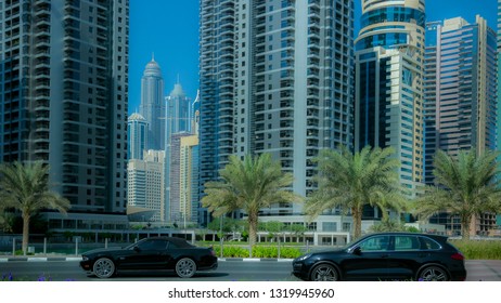 The Modern Town, On The Road Going Cars, Green Trees On The Sidewalks,Time Lapse. Summer Day, The Sun Is Shining, People Rush To The Office To Work.