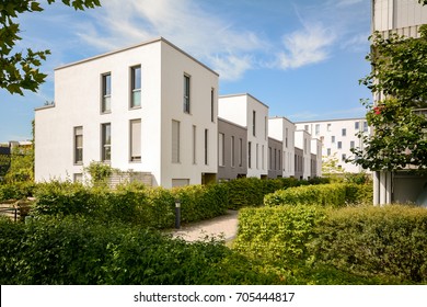 Modern Townhouses In A Residential Area, New Apartment Buildings With Green Outdoor Facilities In The City