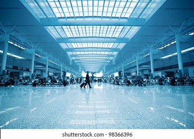  modern train station waiting room and passengers motion blur in shanghai - Powered by Shutterstock