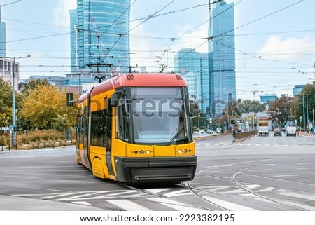 Modern tram on city street. Public transport
