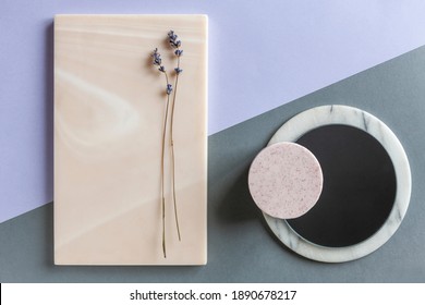 Modern trendy SPA and wellness concept with lavender soap on natural stones plates. Close up, top view on neutrals tones paper background