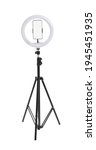 Modern tripod with ring light and smartphone isolated on white