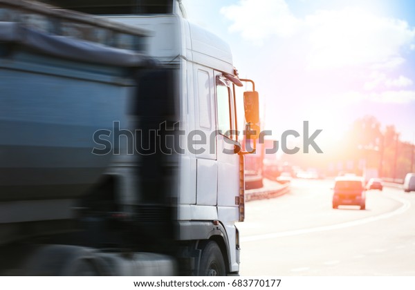 Modern\
truck on road. Wholesale and logistic\
concept