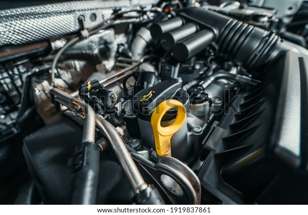 Modern turbocharged eco-friendly engine or motor under\
vehicle hood close up
