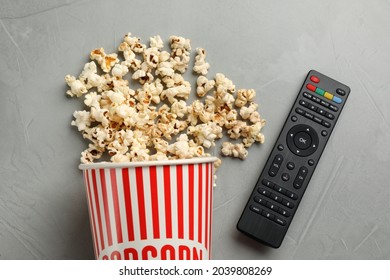 Modern Tv Remote Control And Popcorn On Grey Table, Flat Lay