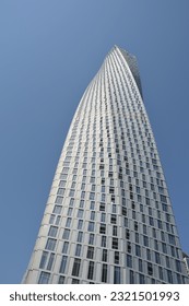 Modern twisted skyscraper on hot and sunny day. Dubai, United Arab Emirates