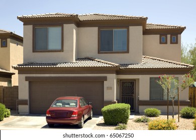 Modern Two-story Single Family House With Garage And Car In Driveway