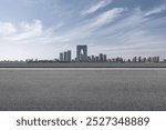 Modern Urban Skyline Under Blue Sky with Road in Foreground  