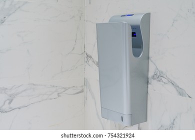 Modern Vertical Hand Dryer In Public Restroom WC