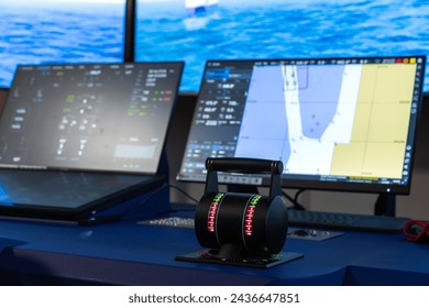 Modern vessel control panel with the engine accelerator and digital screens, close up photo with selective focus. Electronic equipment of marine navigation simulation system,