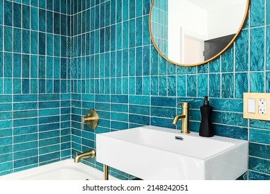 Modern and Vibrant Bathroom. Blue and Green Tile bathroom with gold fixtures and mirror. - Shutterstock ID 2148242051