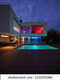 Modern villa with colored led lights at night. Nobody inside
