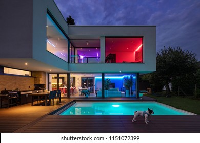 Modern villa with colored led lights at night. Nobody inside - Shutterstock ID 1151072399