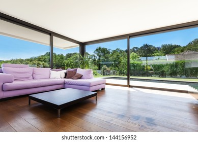 Modern villa, interior, wide living room with divan