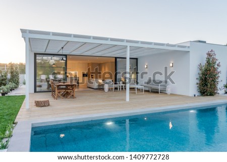 Modern villa with pool and deck with interior