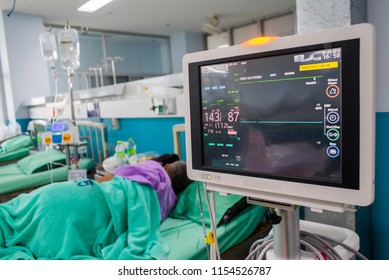 Modern Vital Sign Monitor On Patient Background At Ward In The Hospital.