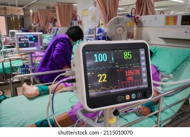 Modern Vital Sign Monitor On Patient Background At Ward In The Hospital.