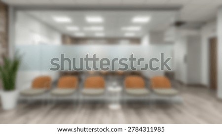 A modern waiting area featuring comfortable orange seating, a frosted glass partition, and a clean, minimalist design. The space is well-lit and inviting, perfect for a professional environment.