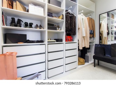 Modern Walk In Closet With Luxury Shoes And Bags