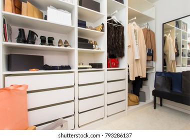 Modern Walk In Closet With Luxury Shoes And Bags