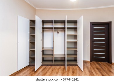 Modern wardrobe with opened doors