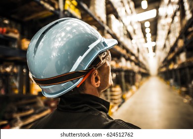 Modern Warehouse Worker In Safety Helmet