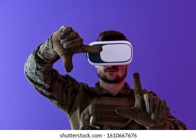 Modern Warfare Futuristic Soldier Using Vr Virtual Reality Glasses On Purple Background