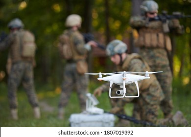 Modern Warfare Soldiers Squad Are Using Drone For Scouting And Surveillance During Military Operation In The Forest.