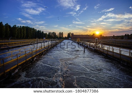 Modern wastewater treatment plant. Tanks for aeration and biological purification of sewage at sunset